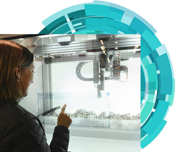 A woman is pointing a product showcase on the show floor.