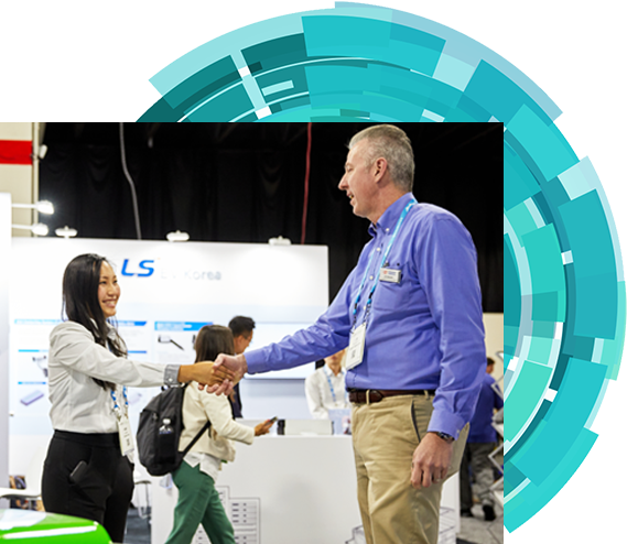 an Exhibitor is shaking hands with an attendee on the expo hall